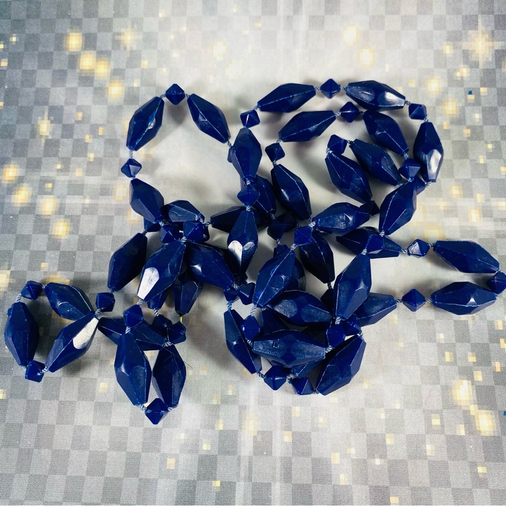 Very cool vintage long strand of geometric shaped plastic beads. Hong Kong 48”